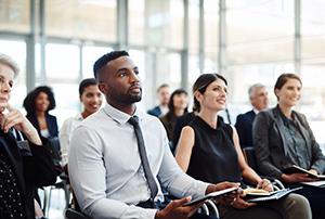 Shot of a group of businesspeople attending a conference